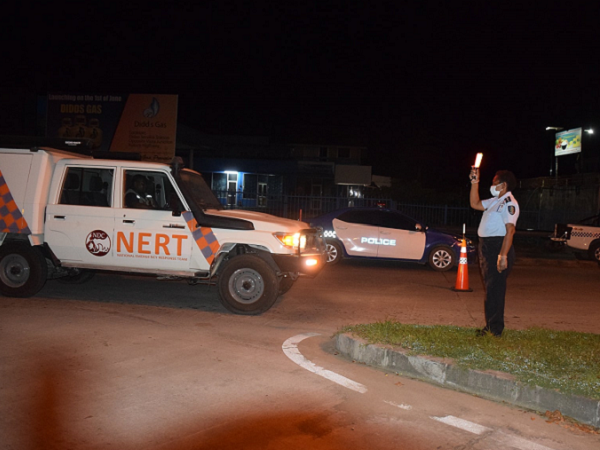 Police contoling traffic at check point on Sunday night