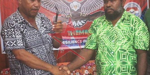 The handshake that bring about peace in Auki yesterday. Picture By Wilson Saeni