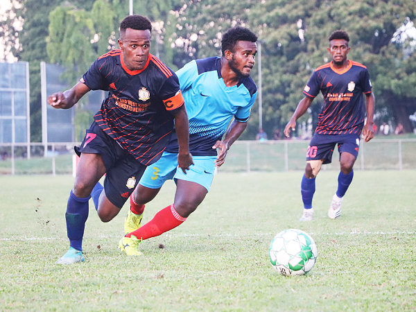 Micah Lealafa of Waneagu FC edges past Collin Lokata, Isabel FC defender.