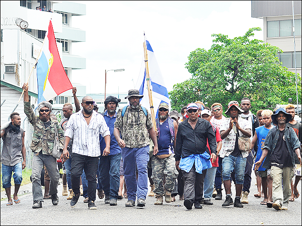 Protesters head to the parliament house on November the 24th, 2021.