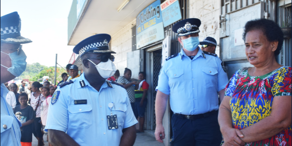 AC Pogeava and AFP officers chat with a member of the community.