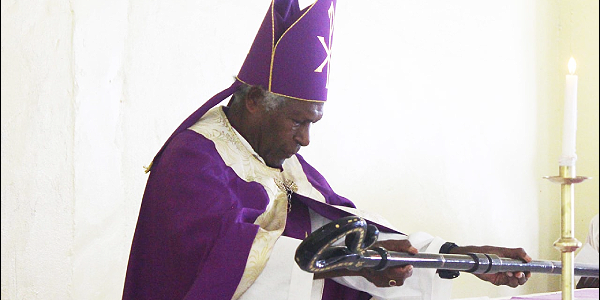 The Right Reverend Bishop Ben Seka laying down the Pastoral staff on the Alter. Photo: ACOM.