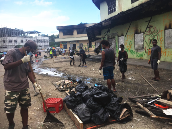 Volunteers cleaning up Chinatown.