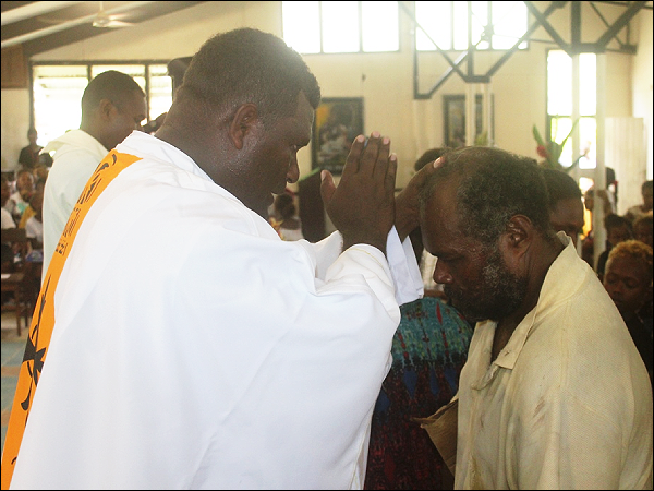 Fr Lawrence Maelesau conduct his first blessing at St Augustine cathedral in Auki after his ordination.