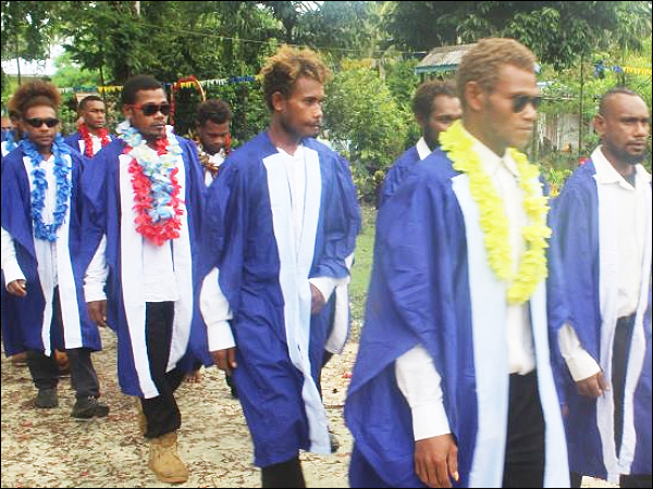 Graduating students parading to the graduation venue.