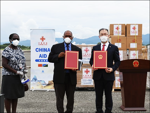 Permanent Secretary Pauline McNeil, Minister Togamana and Ambassador Li Ming during the arrival of PRC humanitarian supplies