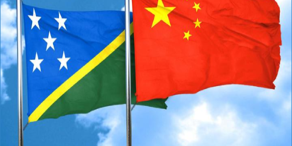 Solomon Islands and Chinese flags.