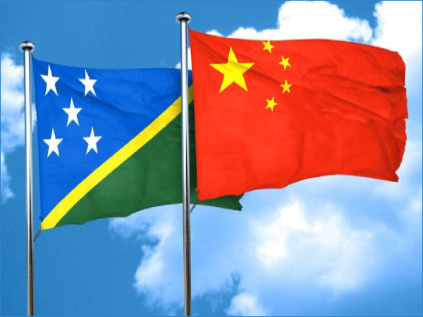 Solomon Islands and Chinese flags.