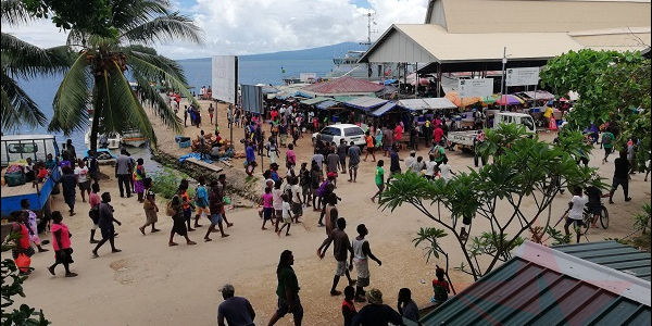 Looking across Gizo MSG building as pack of people walking at the Gizo main road Photo Supplied (1) (1)