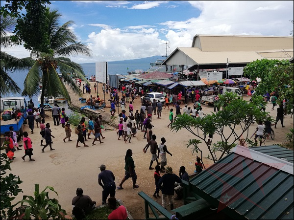 Looking across Gizo MSG building as pack of people walking at the Gizo main road Photo Supplied (1) (1)