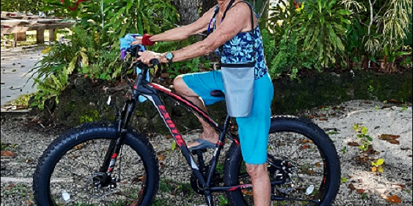 Patty Maliu Greene posing with a bicycle at the Liaparu island in Vonunu, Vella La Vella Island Western Province.