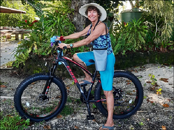 Patty Maliu Greene posing with a bicycle at the Liaparu island in Vonunu, Vella La Vella Island Western Province.