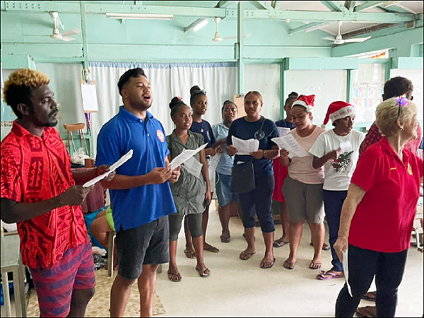 Roteracts singing christmas carols in one of the wards.