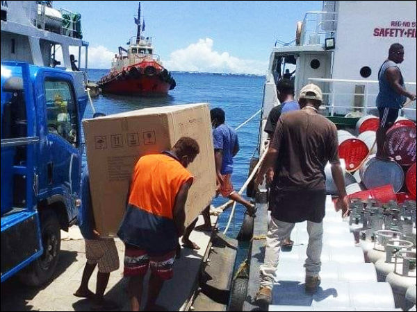A Solar Deep Freezer being transported into MV Vaka Solomone enroute for Sepi for the Sepi women for storage.