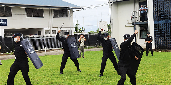 Chinese Police Trainers demonstrated the use of the protective shields.