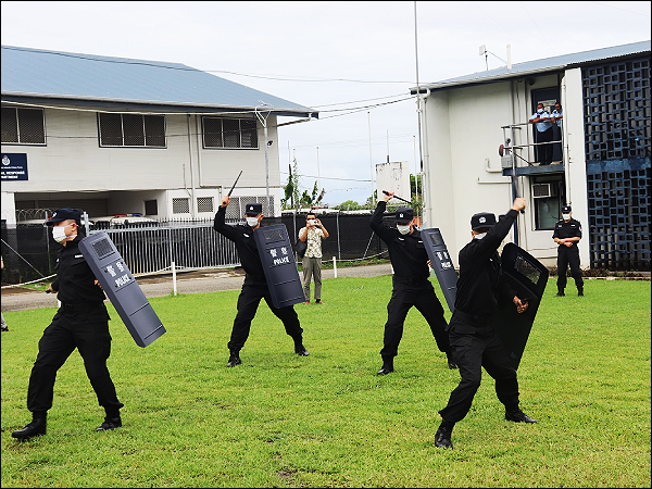Chinese Police Trainers demonstrated the use of the protective shields.