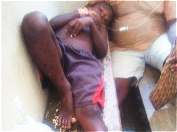 The 9 year-old boy attacked by the croc at the Gupuna clinic awaiting treatment.