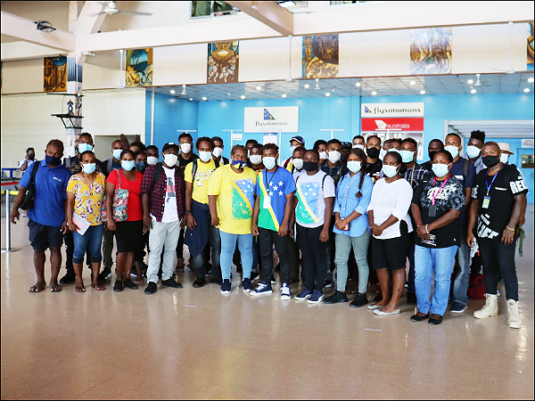 A group of seasonal workers that left for Australia in March of last year. File photo.