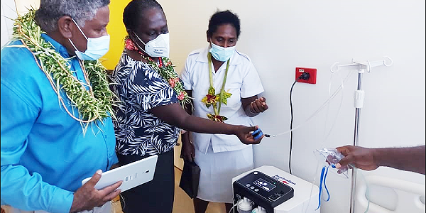 MP Ishmael Avui, PS of Health Pauline McNeil, and a nurse being shown one of the oxygen concentrators used in the clinic. (Photo supplied)