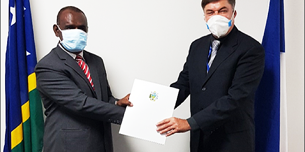 Minister of Foreign Affairs and External Trade. Hon. Jeremiah Manele (left) hands over the Exequatur, formalizing the appointment of Mr. Robertus Bochman, as the new French Honorary Consul in Solomon Islands. (Photo: GCU)