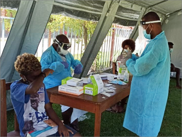 Frontliners in Kira Kira collecting Swabs from patients upon their arrival at the Kirakira hospital. Photo: MHMS.