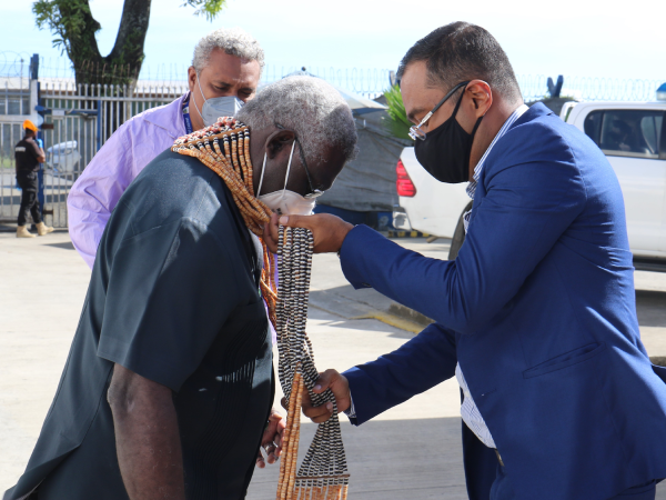 SITCO GM presenting a traditional shell money to PM.