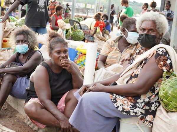Some of the Paelongo women from West Gizo who usually sell fresh green coconuts at the main Gizo market waiting for the public transportation to return to their homes.