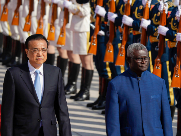 Chinese premier Li Keqiang, left, and Prime Minister Manasseh Sogavare reviewing an honor guard during a ceremony in Beijing in 2019. Photo: Wang Zhao/AFP/Getty Images