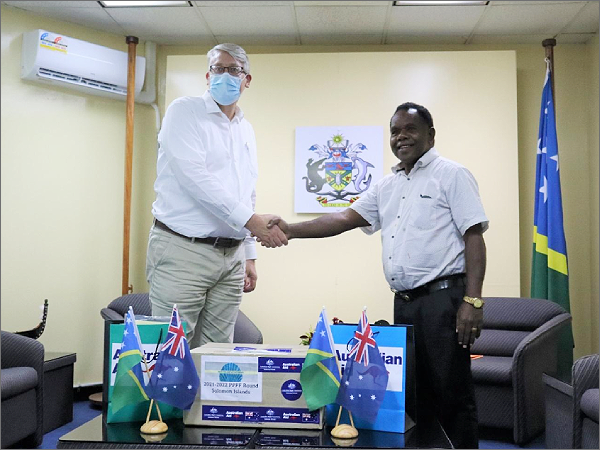 Australian High Commission Political Counsellor Kevin Playford handing over the equipment to Deputy Speaker of Parliament Honourable Commins Mewa. Photo supplied.
