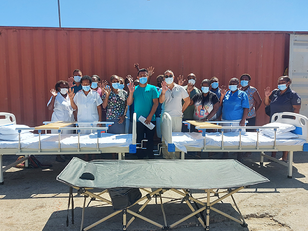 Mr. Michael Leong and Mr. James Fangs (centre) together with Medical Superintendent and NRH nurses and hospital.