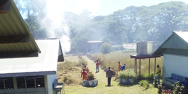 Inmates from Tetere Correctional Centre clearing the Nguvia Community High School grounds on Thursday.