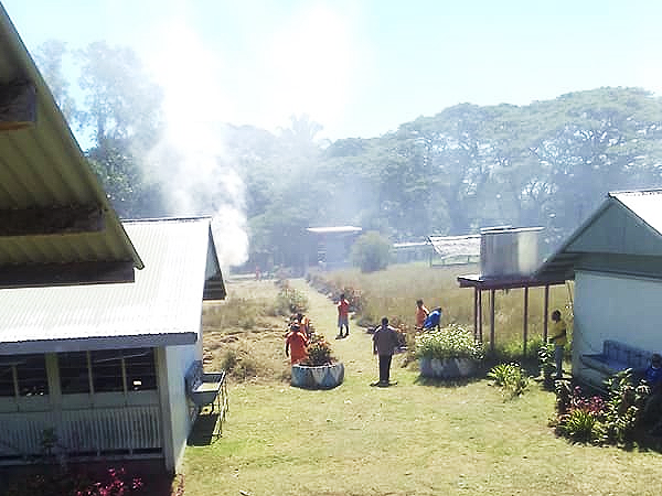Inmates from Tetere Correctional Centre clearing the Nguvia Community High School grounds on Thursday.