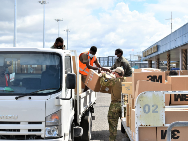 Loading of the equipment boxes at the Henderson airport. Photo NZ High Commission Office.