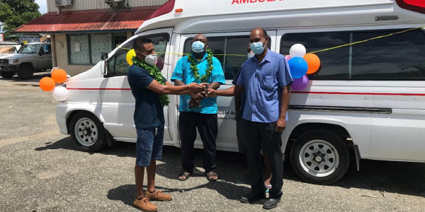 Suresh (left) presenting the $250, 000 fully-equipped ambulance to Guadalcanal Provincial government officials outside the Rita Eleven Building at Kukum on 25th February this year.