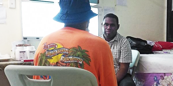Dr Joseph Sangatu (R) interacts with a patient with Dermatological related condition at the Rove clinic. Photo supplied.