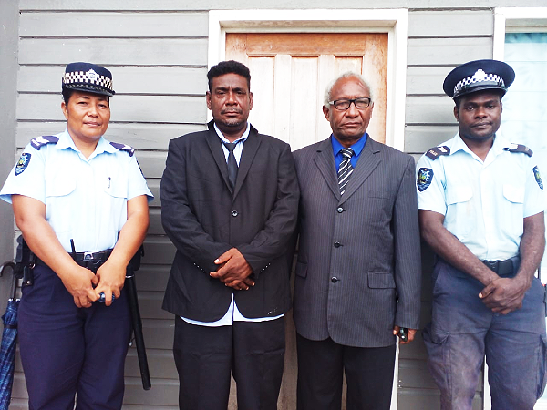 Premier Galaigu and the Speaker Honorable Moah flanked by two Police Officers after the declaration of his premiership in Tulagi, Wednesday.