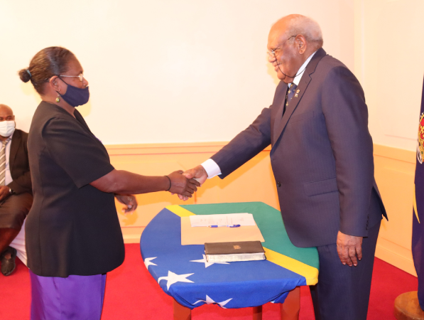 Acting Governor General Patterson Oti congratulates Ms Decima Regatule during her swearing-in ceremony at Government House. Photo supplied.