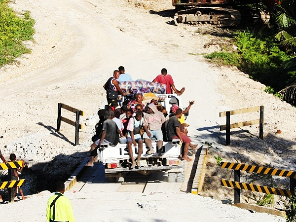 The first loaded vehicle crossing the newly opened bridge.  Photo supplied.