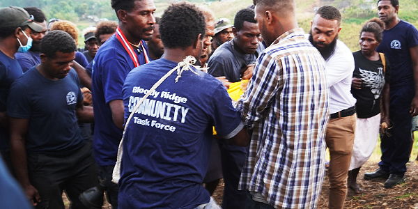 Members of the Bloody Ridge Community Task Force and the public apprehending the culprit (in yellow T-shirt) last week. Photo, Lachlan Eddie.