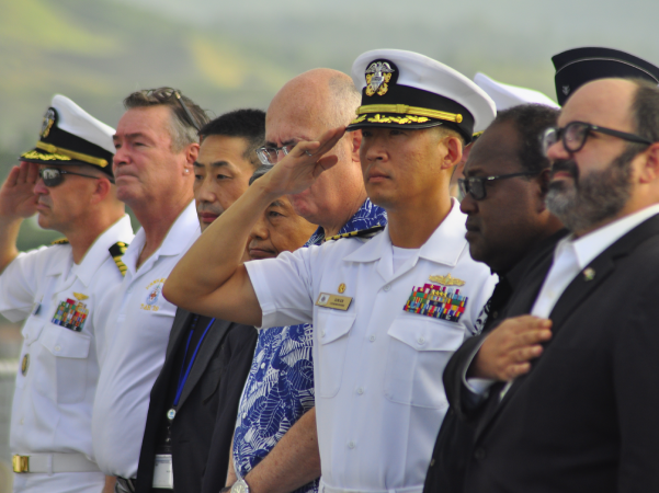 Invited guests and members of the Hospital Ship Mercy, during the National Anthem of the USA. Photo Lachlan Eddie.