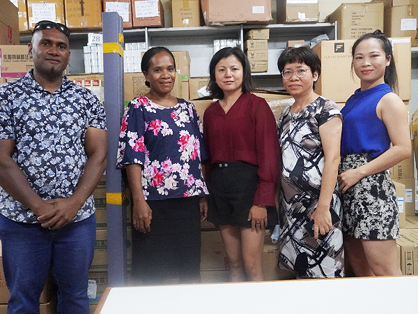 Chinese women support NRH with medicine displayers