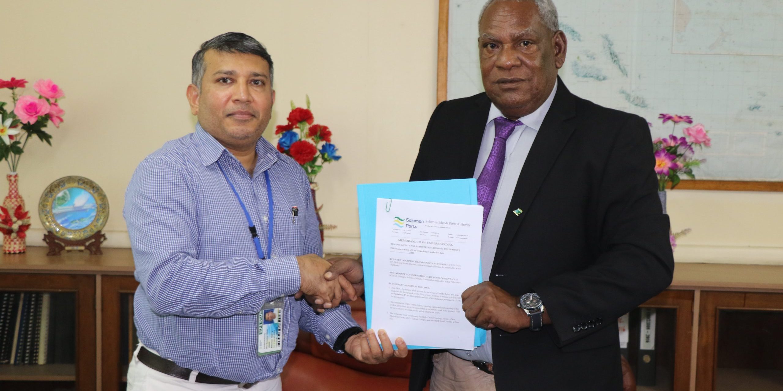 SIPA CEO, Eranda Kotelawala, shakes hands with PS MID, Mr. Stephen Maesiola after signing the MOU.