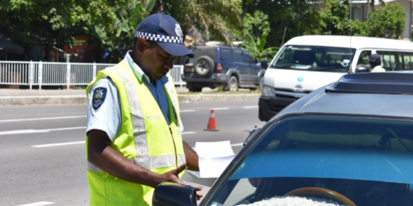 Traffic police inspecting vehicles in one of their many traffic checks. File photo.