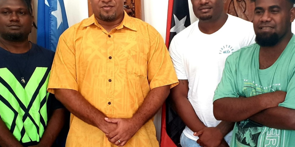 Our envoy in PNG, William Soaki, 2nd from left, with our three musicians. Photo supplied.