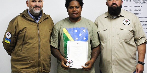 Sterry Junior with his lecturers at the Kosovo Institute.