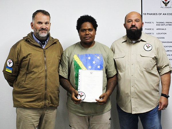 Sterry Junior with his lecturers at the Kosovo Institute.