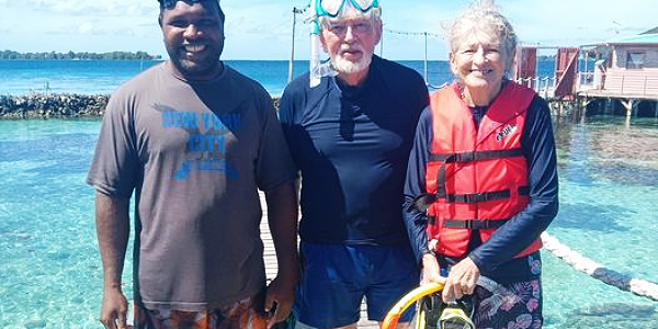 The Imagination Island Resort Manager, Alphonse Waleronoa with the two overseas couple posing at the Imagination Island Resort.