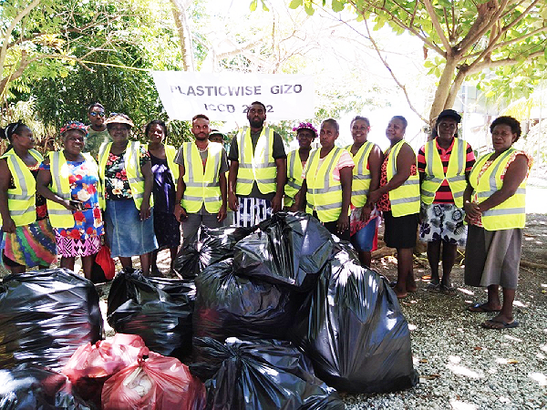 Plastic Wise Gizo (PWG) members pose for a photo after the clean up program.
