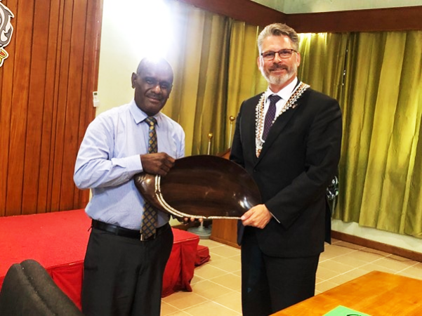 Minister of Foreign Affairs and External Trade, Hon. Jeremiah Manele presenting a gift to the High Commissioner of Canada to the Solomon Islands, His Excellency, Mr. Mark Glauser during their meeting on Wednesday.