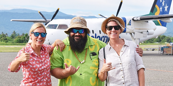 The Very Hungry Nomads, Martina on left and Rachel on right, with Tourism Solomons Team Leader Product Marketing, Garedd Porowai.